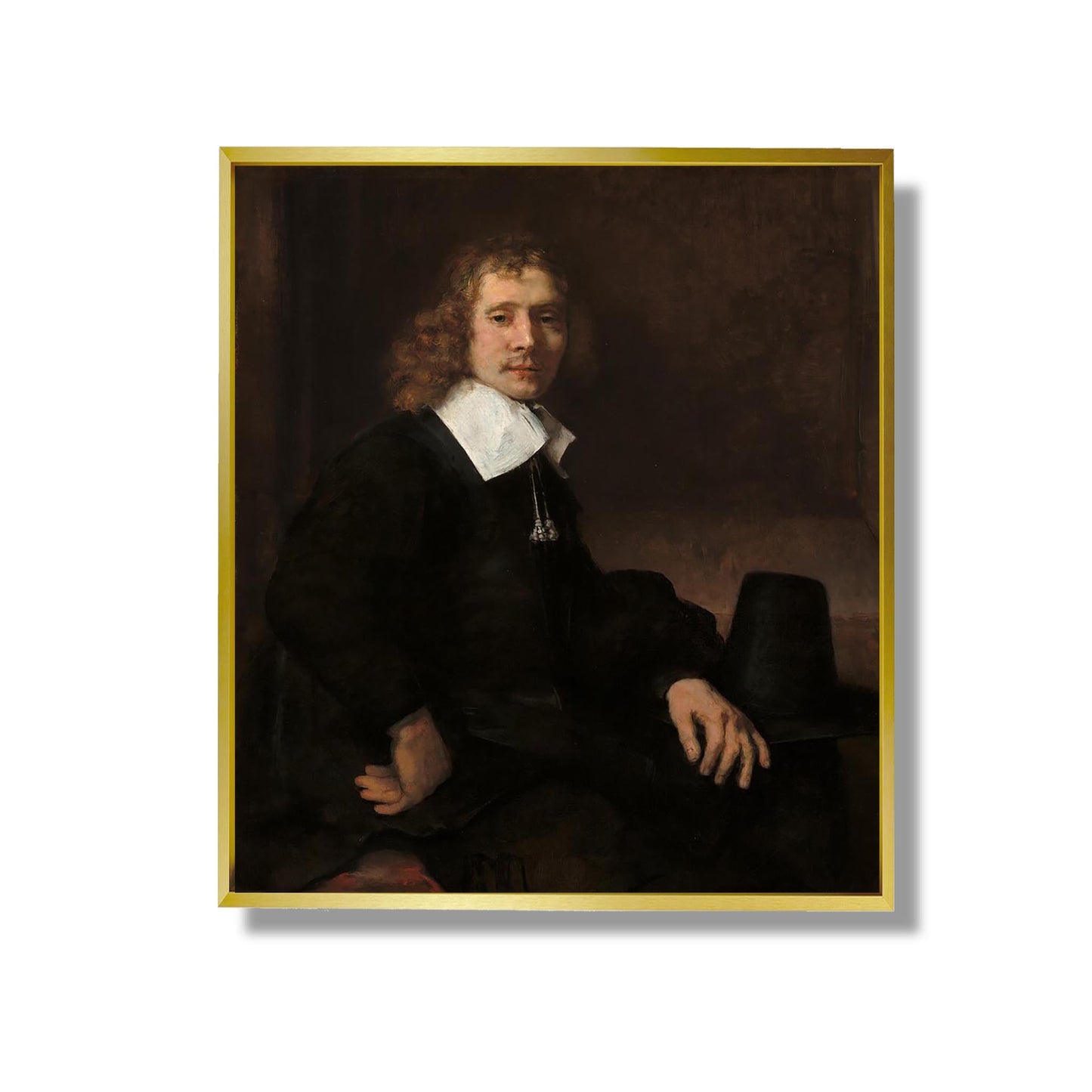 Un jeune homme assis à une table (peut-être Govaert Flinck) - Rembrandt